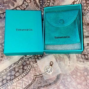 used Tiffany&Co peace charm for necklace or bracelet.